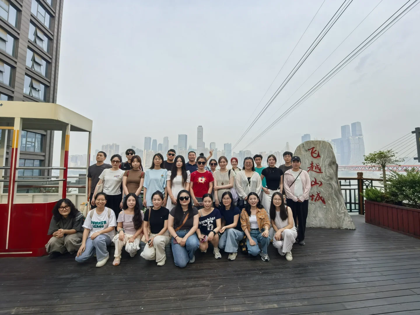 KEEYAK team together beside the Chongqing skyline